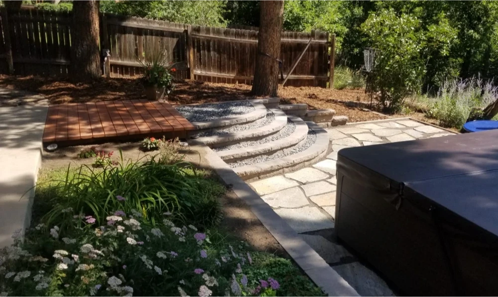 Steps and patio pavers built to support a backyard hot tub.